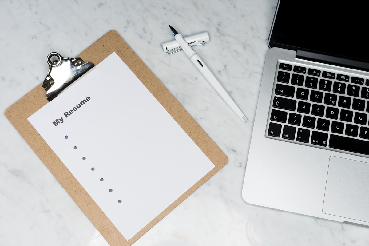 Handwritten path notes and planning worksheets on a desk beside a calculator
